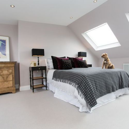 A fine example of a double bedroom created by a dormer loft conversion – with velux windows