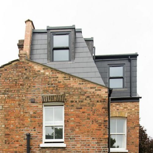 Outside view of an end of terrace Victorian house with Dormer Loft Conversion